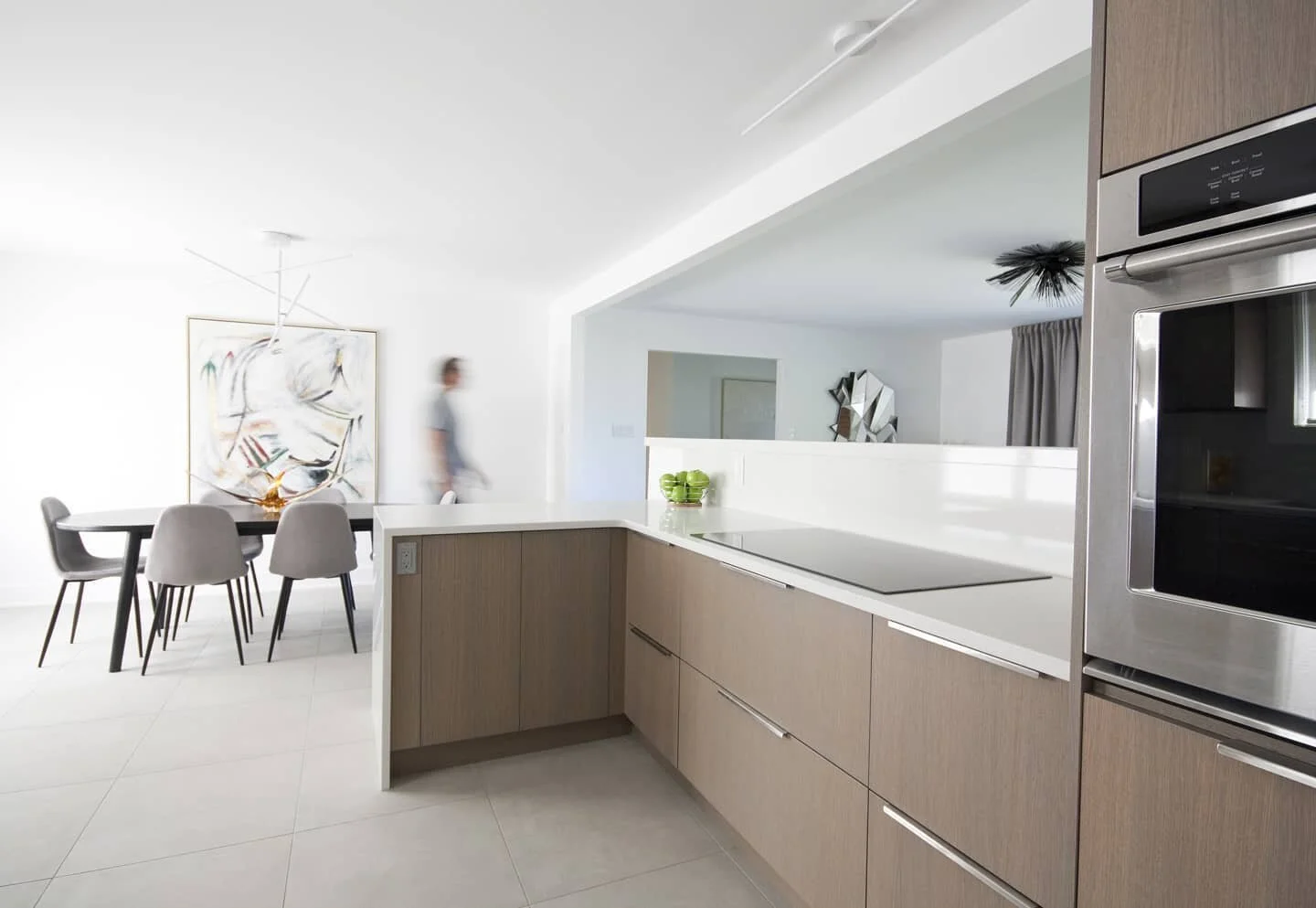 A scandinavian inspired revamp. A bright kitchen with modern warm finishes replaces a dark and dated kitchen. The removal of a wall allows natural light in and more direct views to the outdoors, while maximizing the usable interior space. Swipe left 