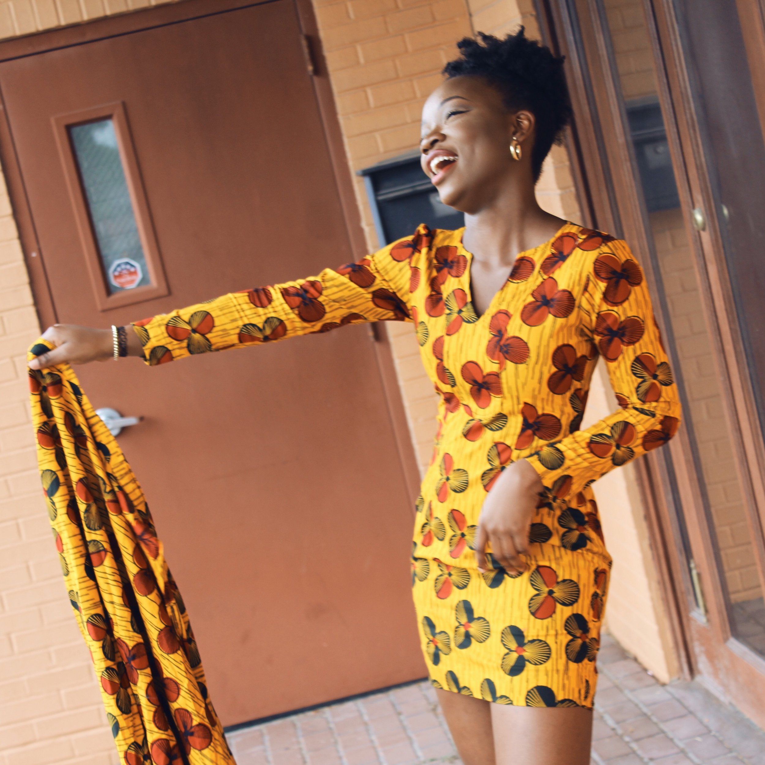 smiling african with ankara dress