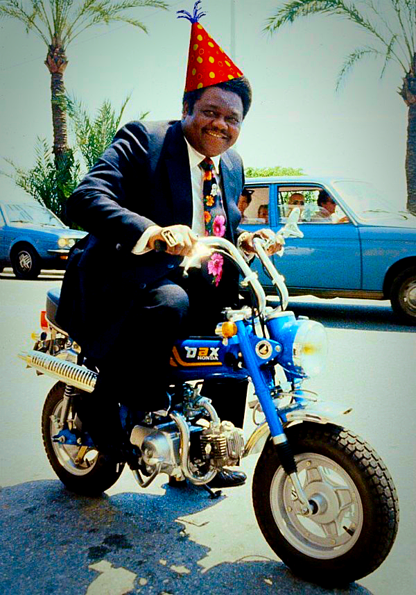 Fats Domino free wheelin' and wearing a party hat that we may or may not have added.