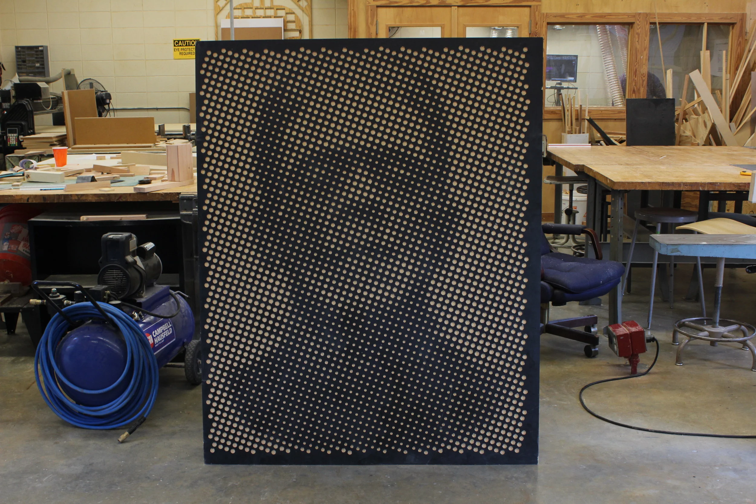  This is a little shop experiment on making large images using just CNC-ed pockets and light and dark contrast. I found a dxf generator online that output the circle pattern. Then I rolled on some black paint and milled out the "white". It turned out