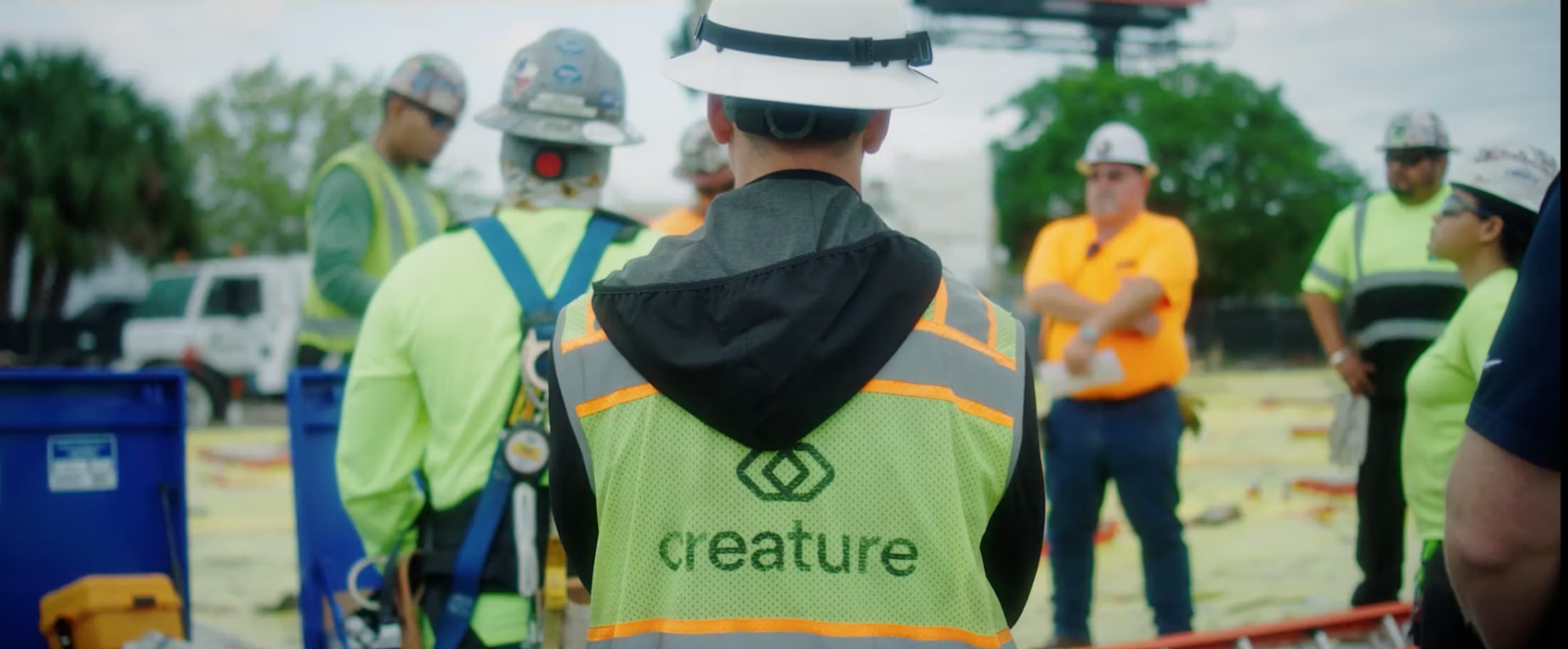 Creature employees meeting at the jobsite