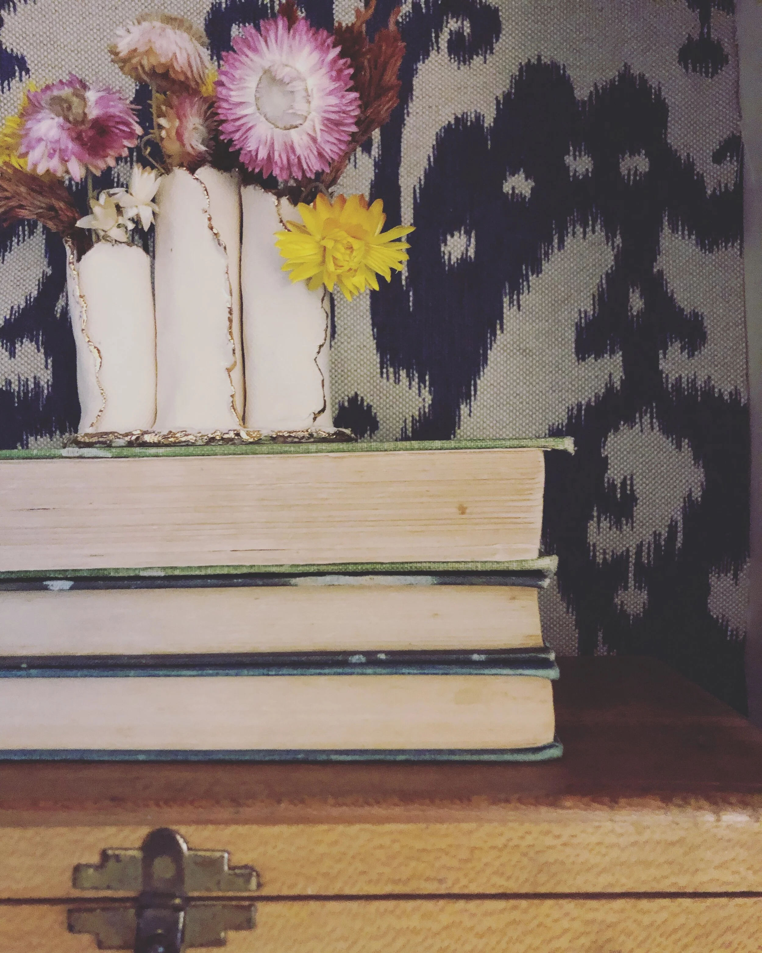Dried blooms from Hummingbird Gardens in a vase by local artist Carved in Mud