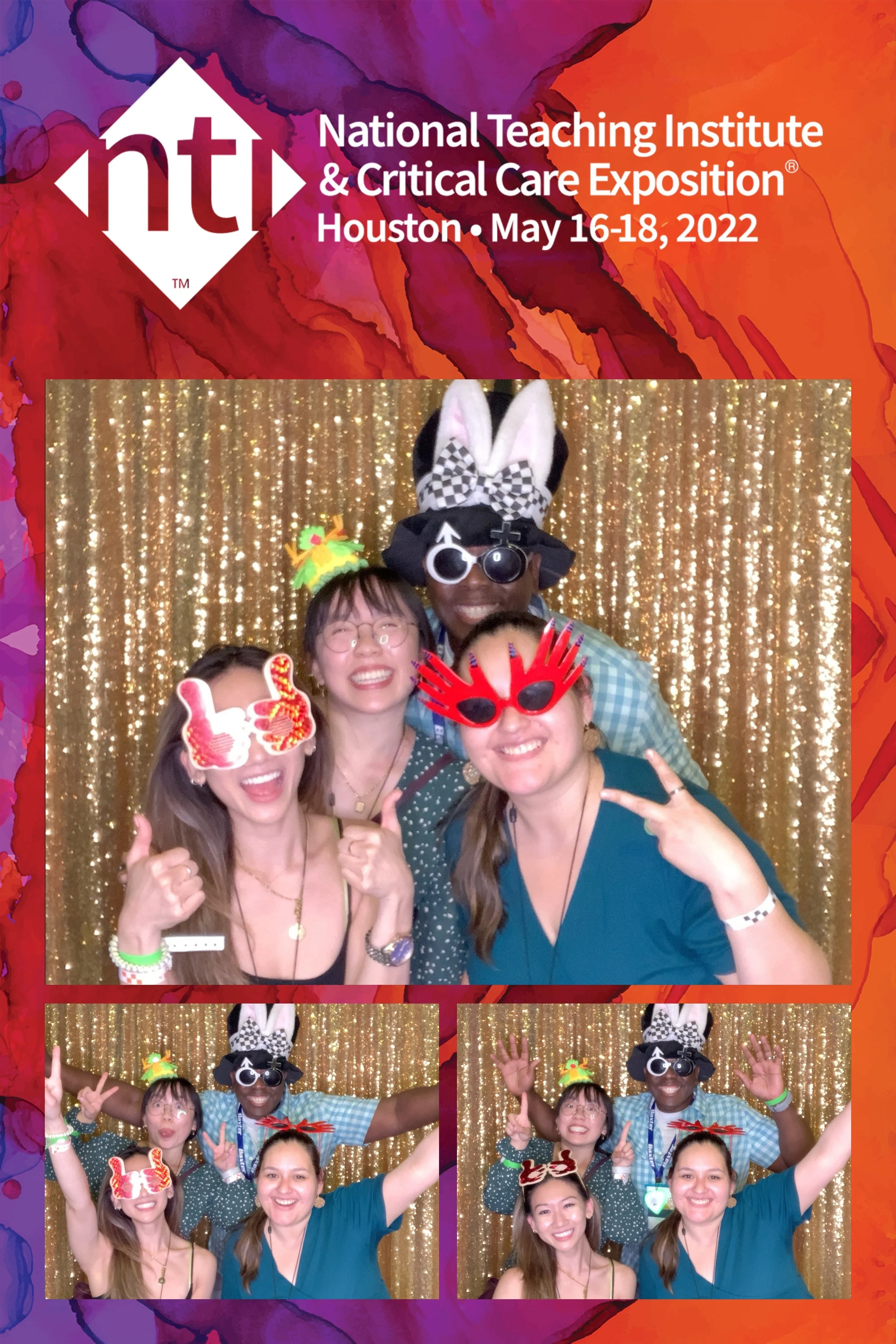 Group of people at a photo booth, wearing fun accessories like bunny ears, glasses, and holiday-themed headbands, smiling and posing in front of a gold glitter curtain.