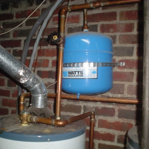 The little blue tank is a hot water expansion tank and will prevent pressure damage to your hot water tank and plumbing. 