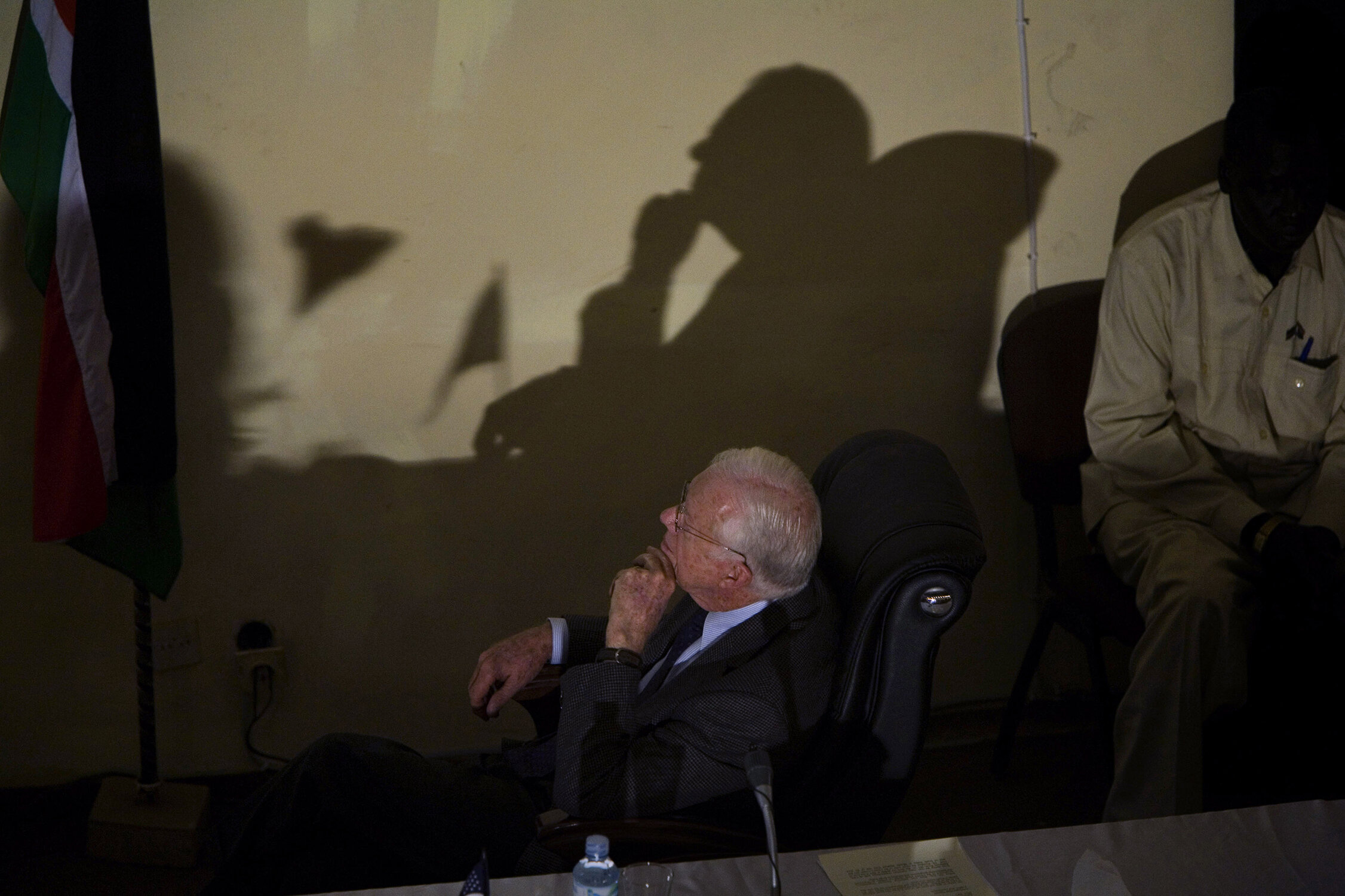  Sitting in the assembly hall of the capitol of South Sudan, former U.S. president Jimmy Carter listens during a presentation about the Carter Center's disease fighting efforts in the war plagued region. (Photo by Wes Pope/Chicago Tribune) 