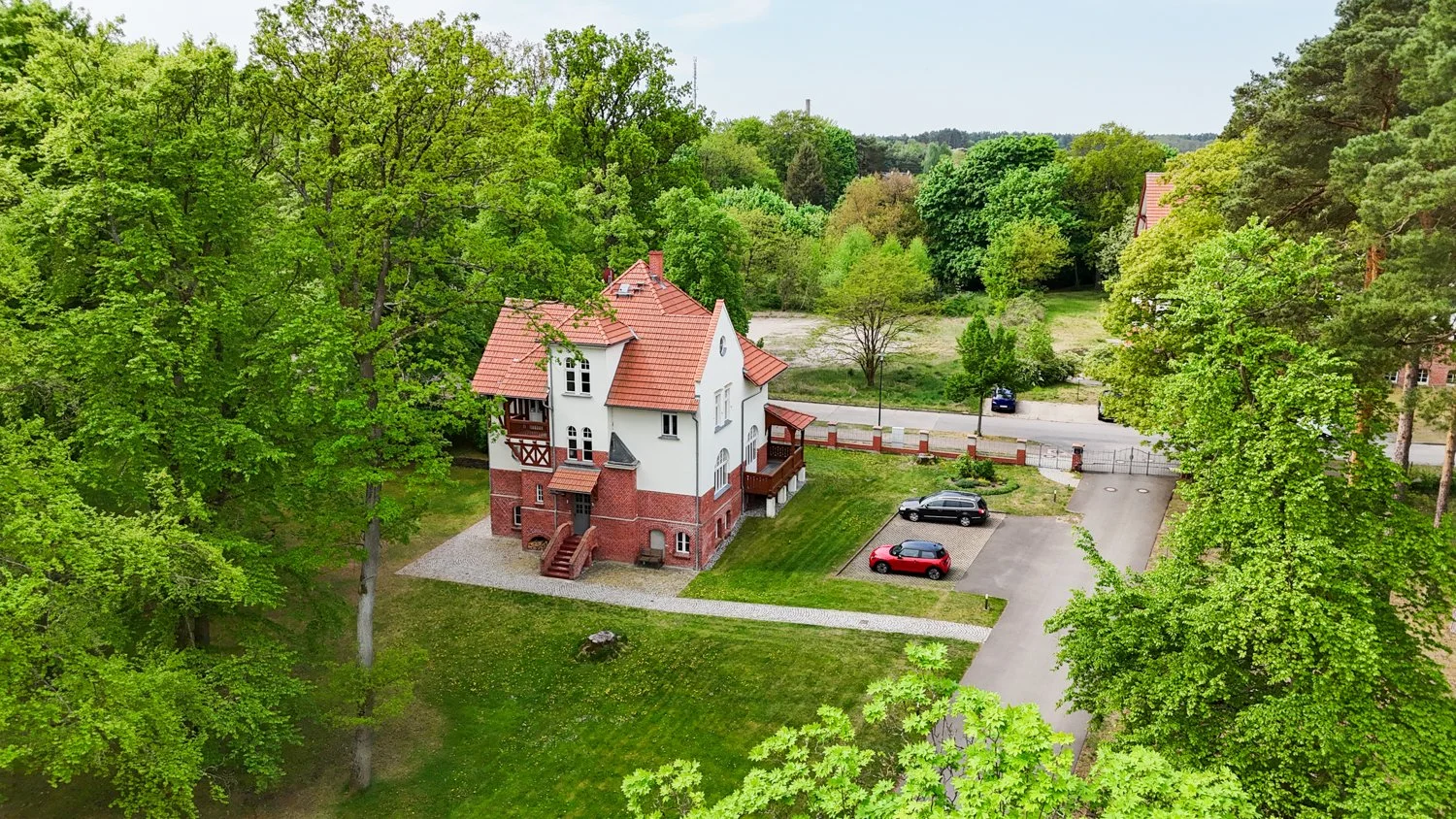 Aerial Drone Photography of Historic Apartments in a Lush Setting