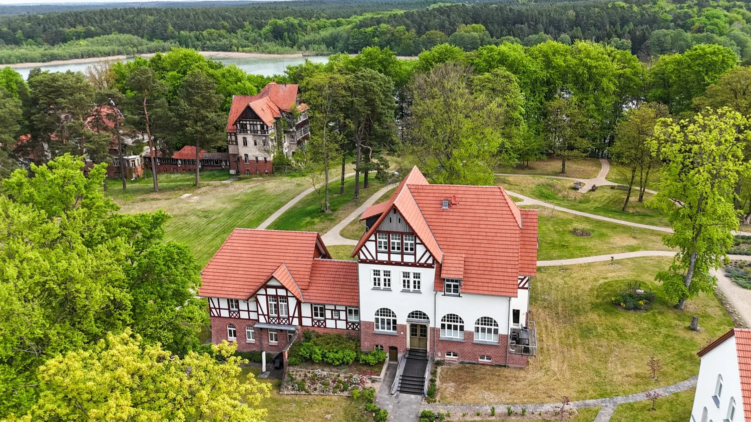 Aerial Drone Photography of Historic Apartments in a Lush Setting