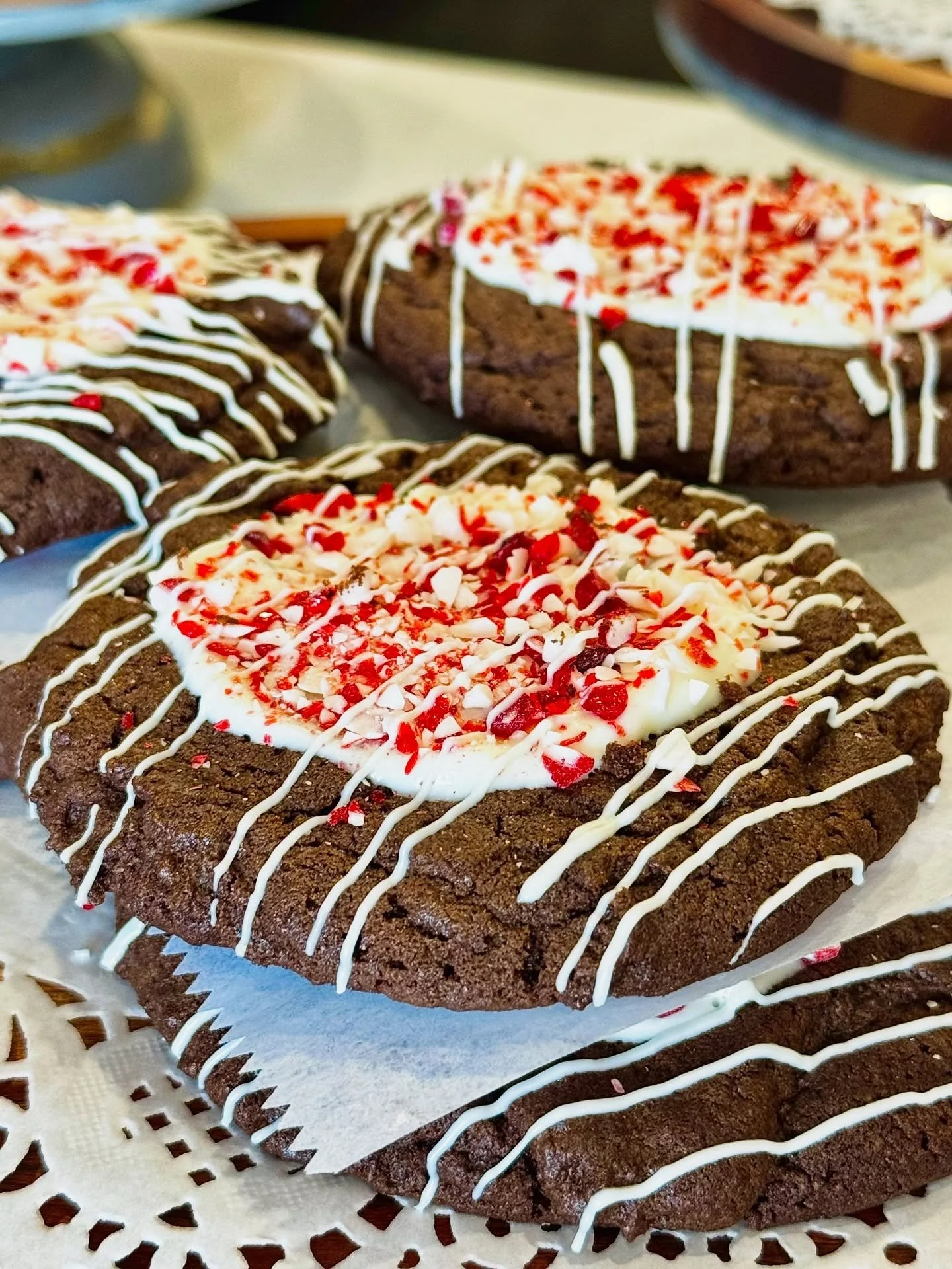 Peppermint Crunch chocolate cookies drizzled with white chocolate, Chocolate Chip, Molasses Crinkles, Ghiradelli chocolate, and butterscotch caramel are definite recommendations for those Christmas boxes and trays from The Cookie People.  Order soon 