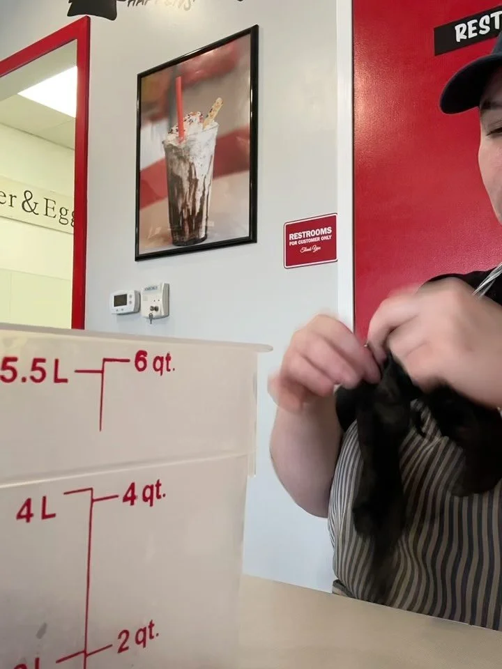 Amber peels LOTS of Peanut butter cups each day for our insanely delicious chocolate peanut butter cup cookies. A soft and chewy chocolate based cookie swirling around a whole PB cup, and then extra peanut butter is added to the top.  It is a sensati