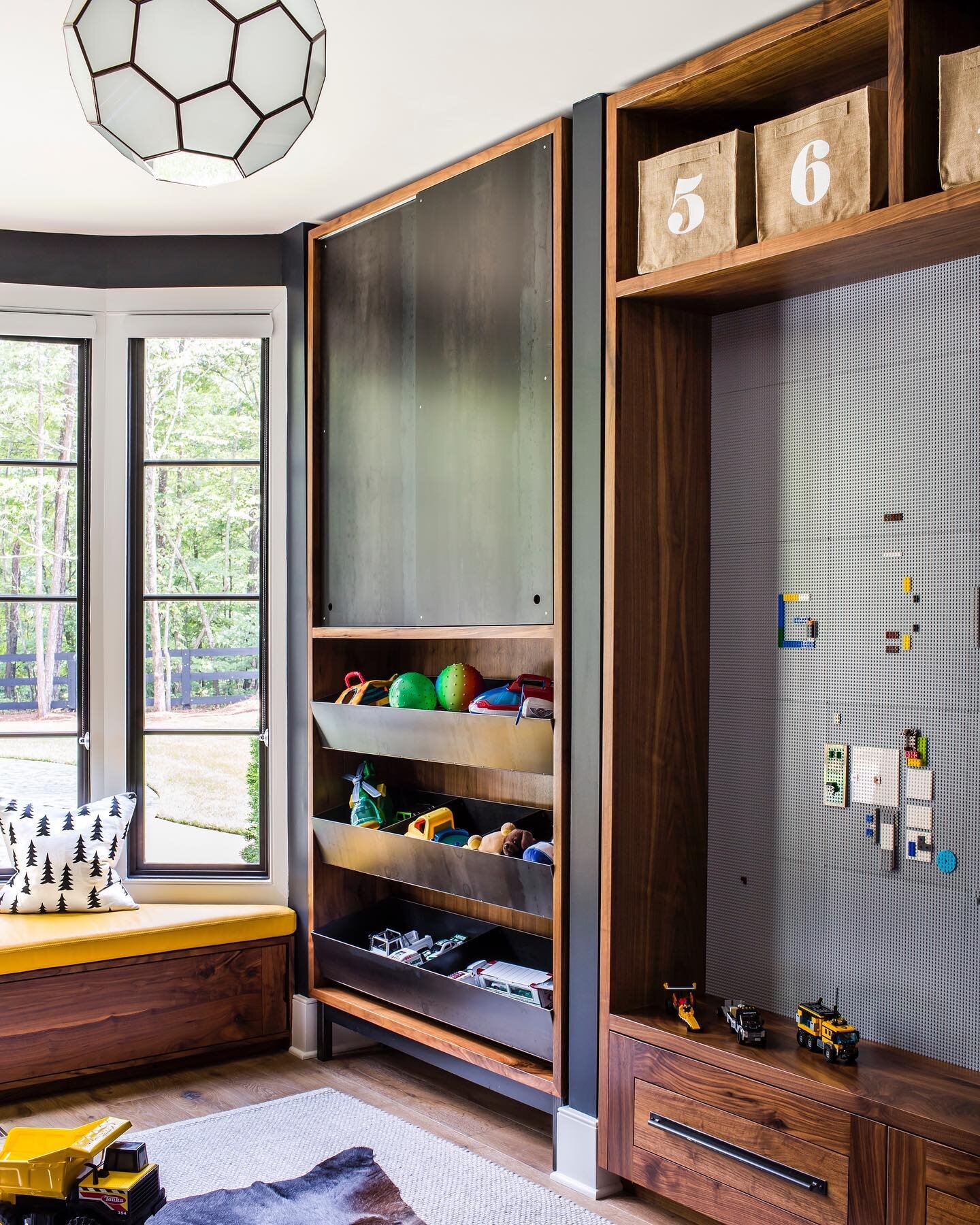 Playroom for the most sophisticated kiddos on the block! 
.
.
.
#playroom #playroomorganization #legowall #customcabinetry #walnutcabinets #steelcabinet