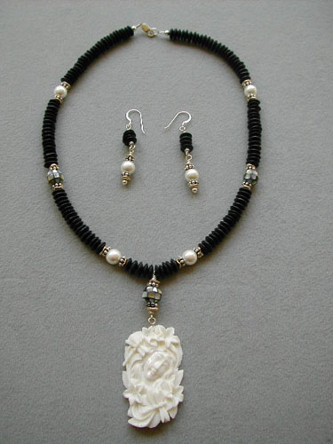 Carved Bone Serene Woman Face