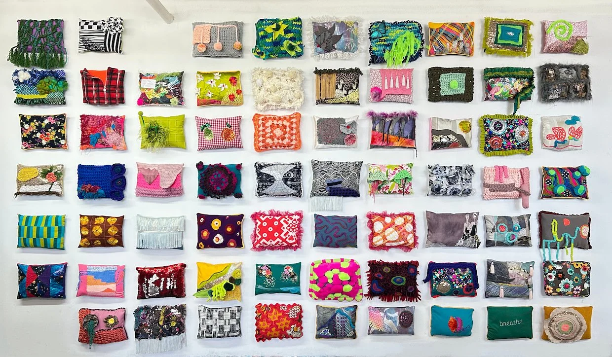 09 All 68 Pillows on a wall .jpg