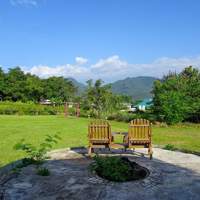 Missing this view a little extra today! Derrick and I spent many afternoons in these Adirondack chairs (Changs in hand 🍺 😉) enjoying the slow-paced lifestyle of Pai, Thailand during our stay at @tribalpaibackpackers. We rented a little bungalow to 