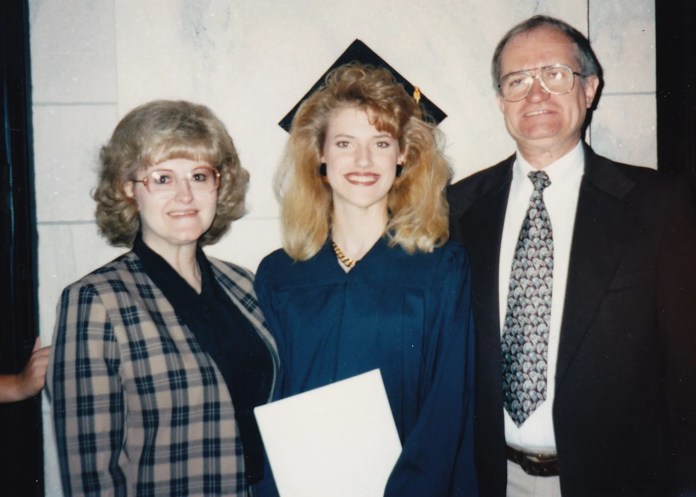 At my graduation from Clarkson College in 1995. Too bad we caught my poor dad mid-blink!