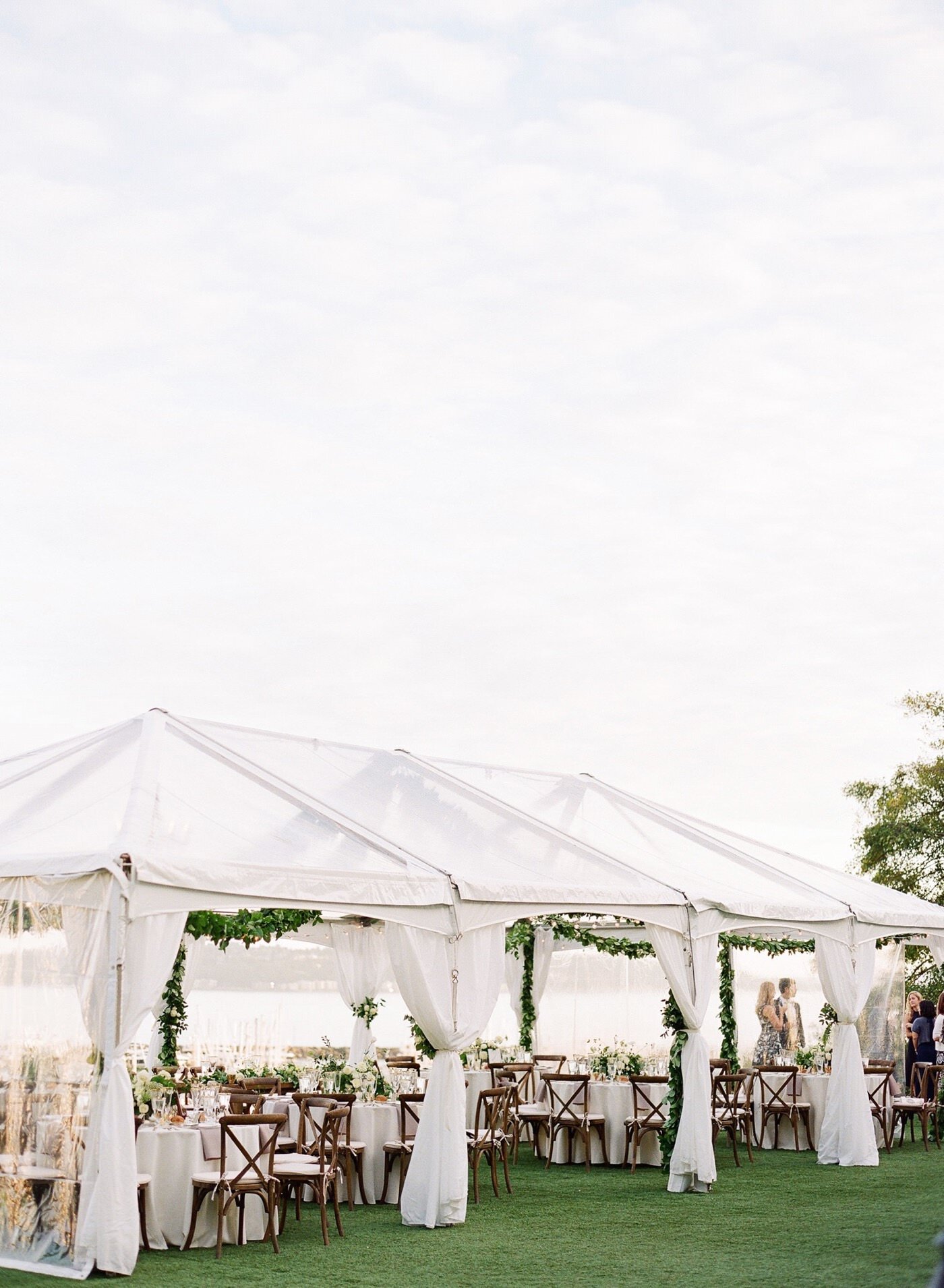 Organic and elegant green and white tented wedding reception at The Admiral's House