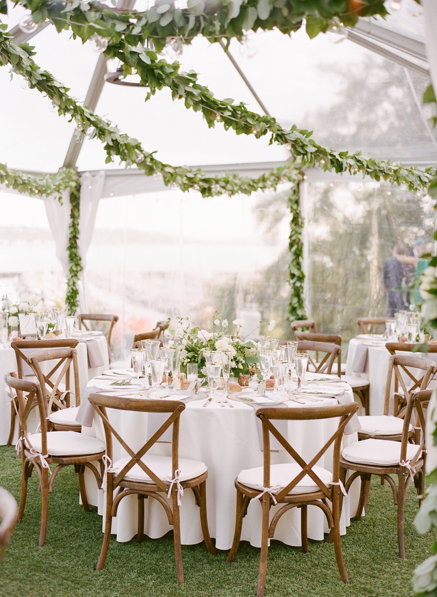 Organic and elegant green and white tented wedding reception at The Admiral's House
