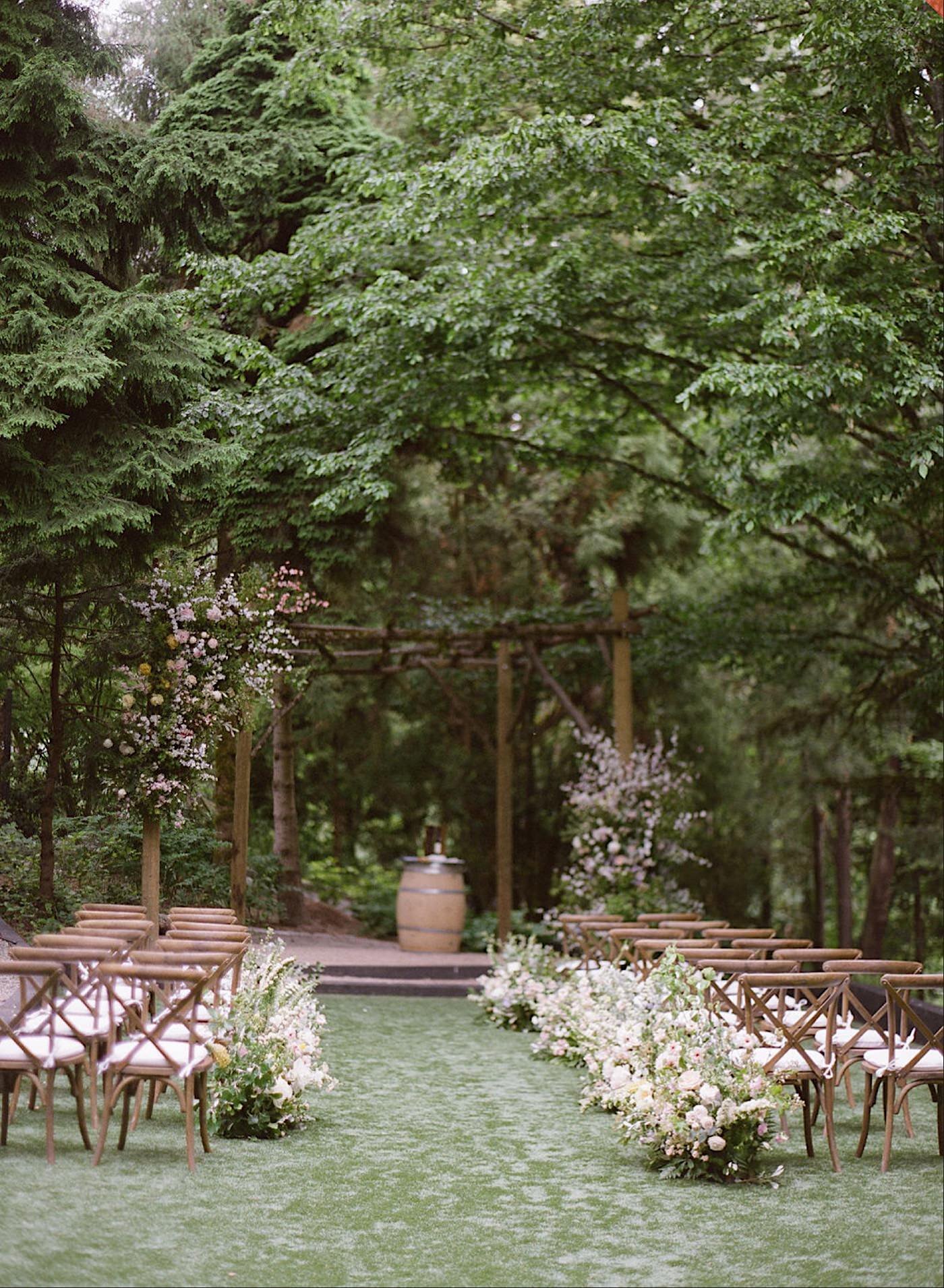 Wedding ceremony on the lawn at JM Cellars with Seattle Wedding Florist Gather Design Company