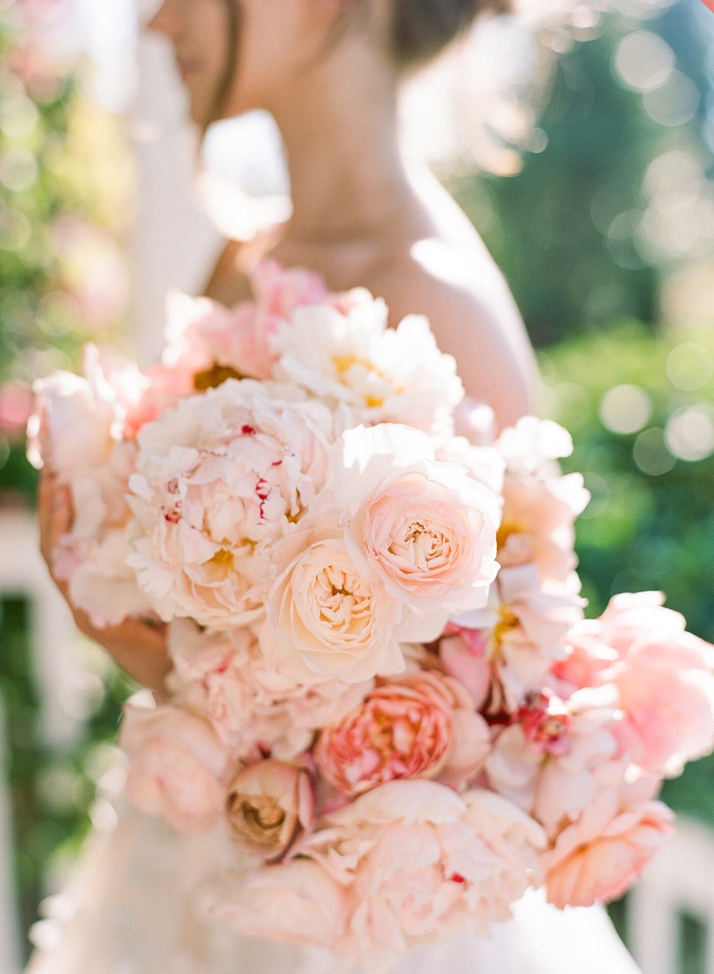 Lush no-foliage bouquet with peonies and garden roses by Seattle wedding florist Gather Design Company