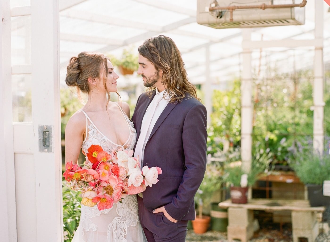 Couple with colorful, tropical-inspired bouquet