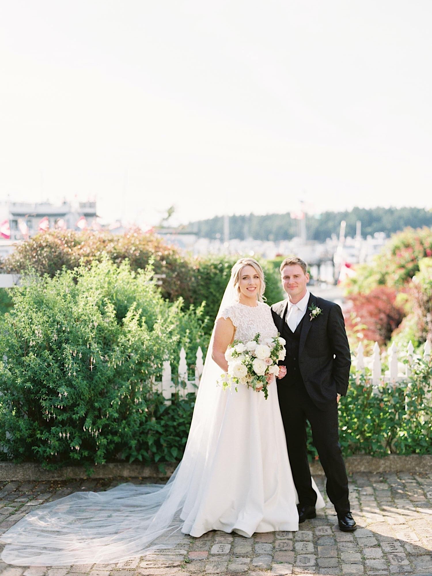 A classic wedding portrait in front of Roche Harbor in the San Juans
