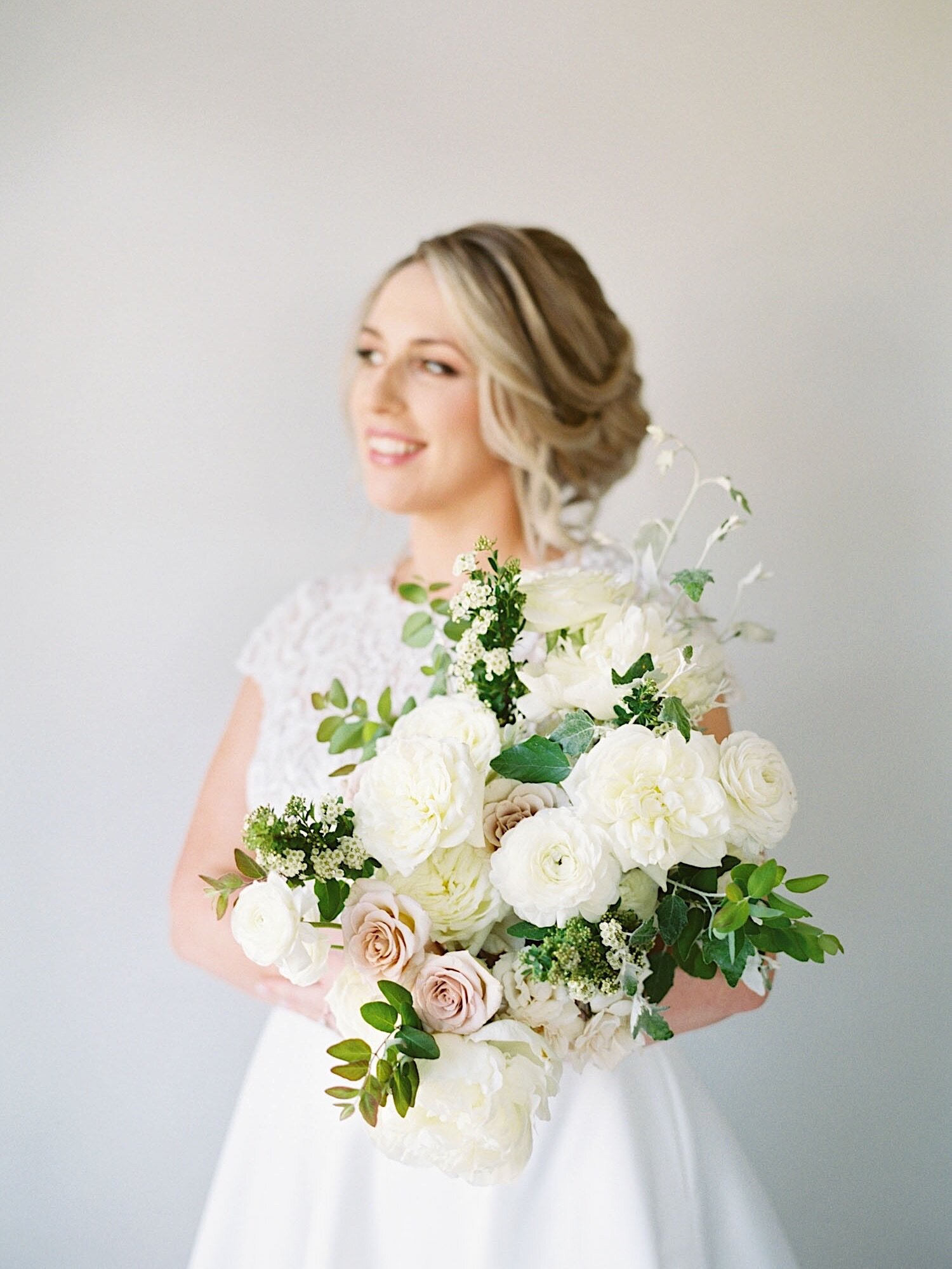 Bridal portrait with romantic green and white bouquet from Seattle Wedding Florist Gather Design Company