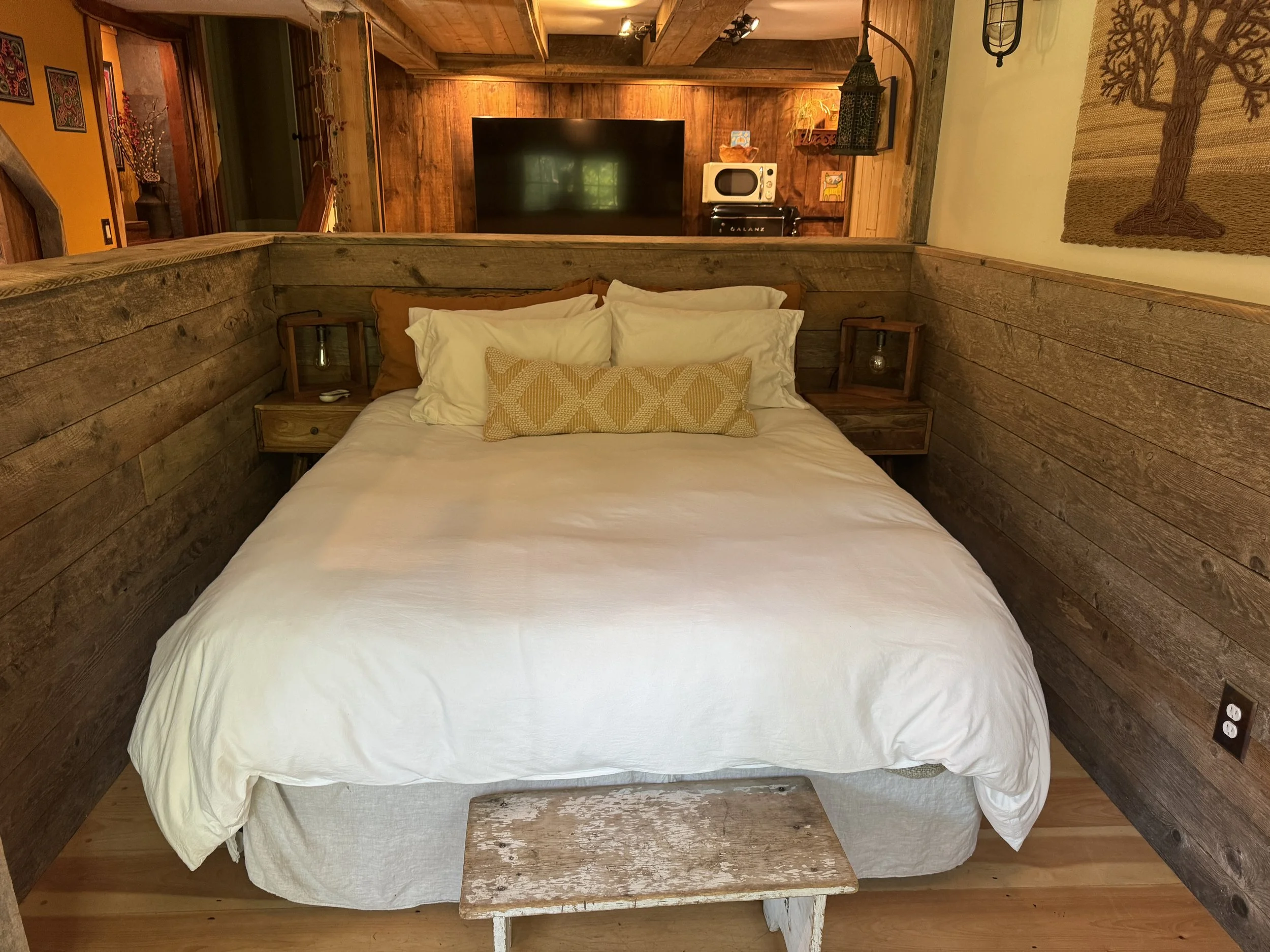 The Den (Queen Bed). This unit is connected to the Farmhouse and can be added to your reservation for an additional fee.