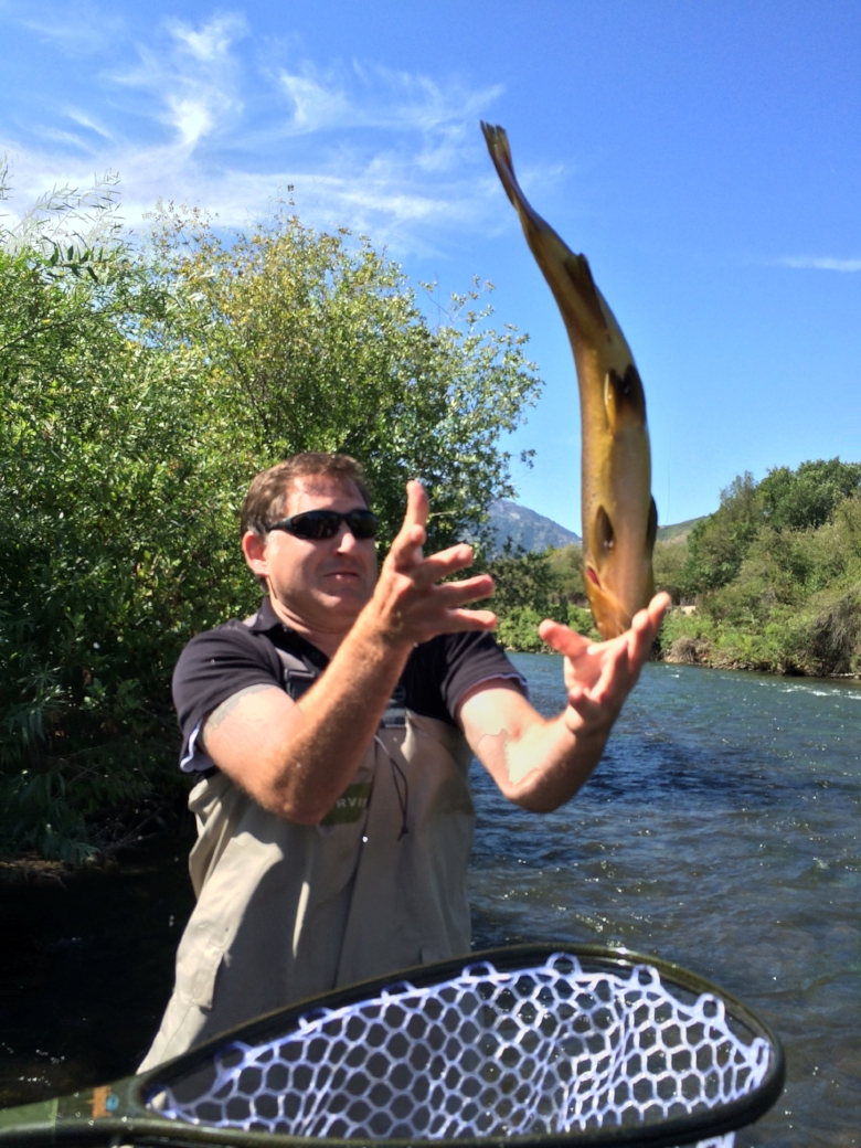 Guerrero "catching" a fish on the Provo River