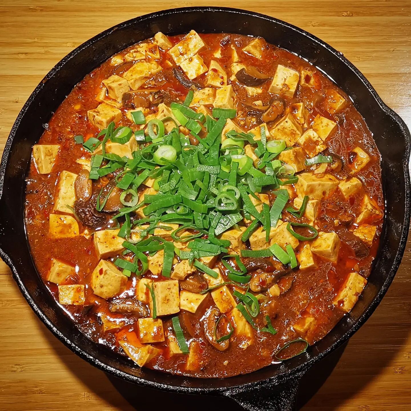 Sometimes we travel to the culinary delights of Sichuan province China. This is a vegan version of Ma Po Tofu 🥘

It isn't as spicy as it looks but it is more delicious than it appears! A creamy bean sauce with numbing peppers, it is a plethora of um