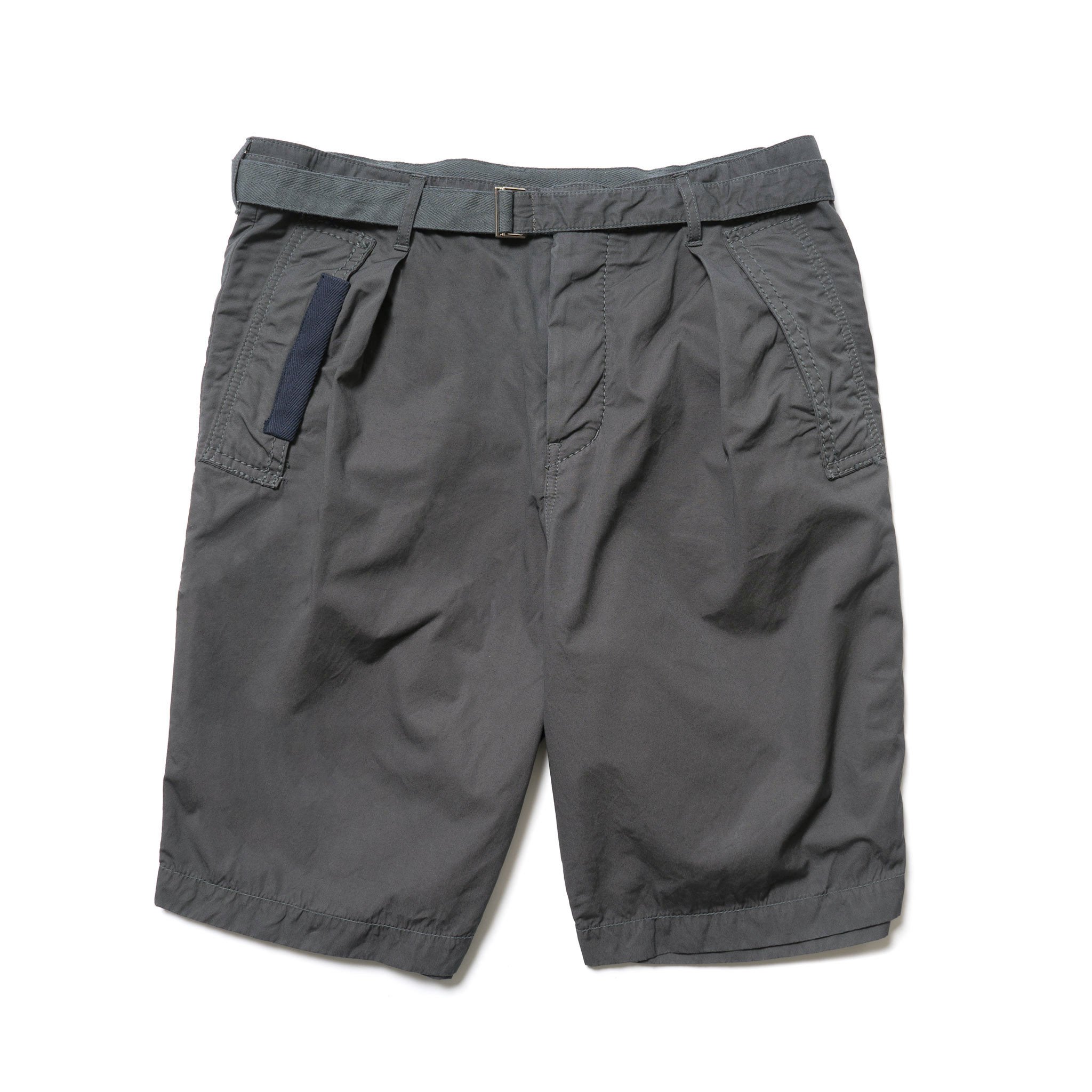 Relaxed fit cotton shorts from Sacai in an overdyed grey textile feraturing slant side pockets and a herringbone ribbon reinforced belt. Available via HAVEN