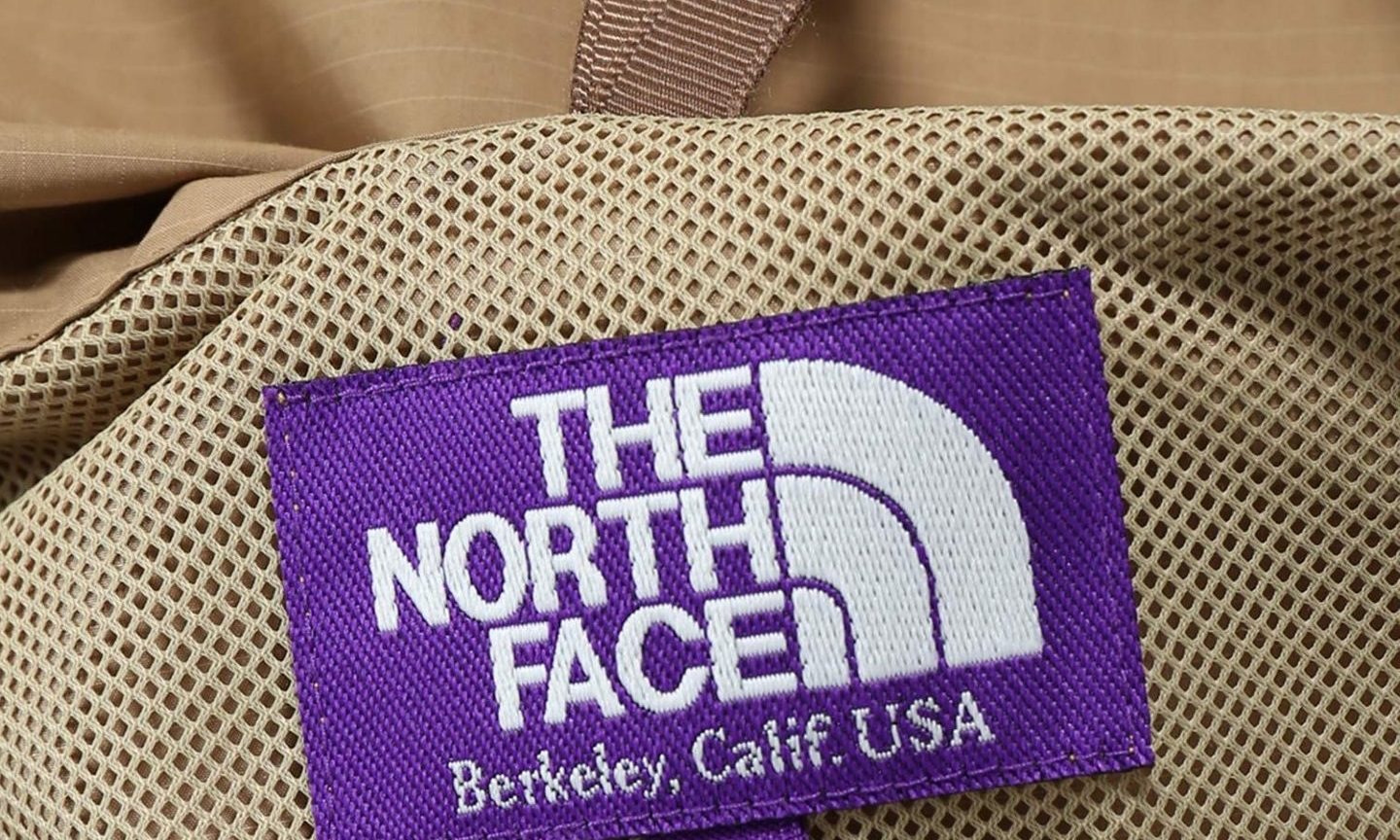 the north face purple label logo