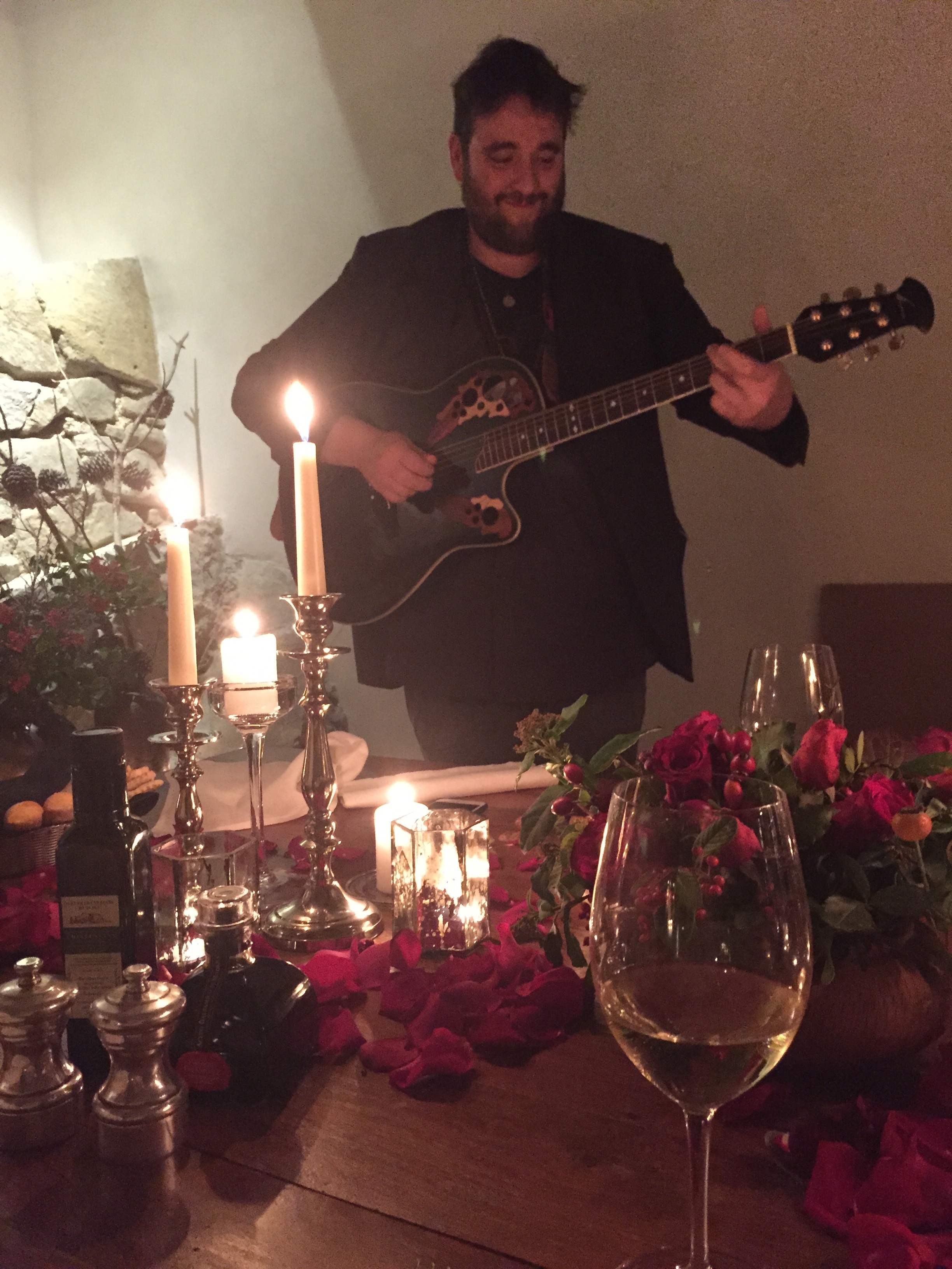 and a musician played love songs on his guitar.