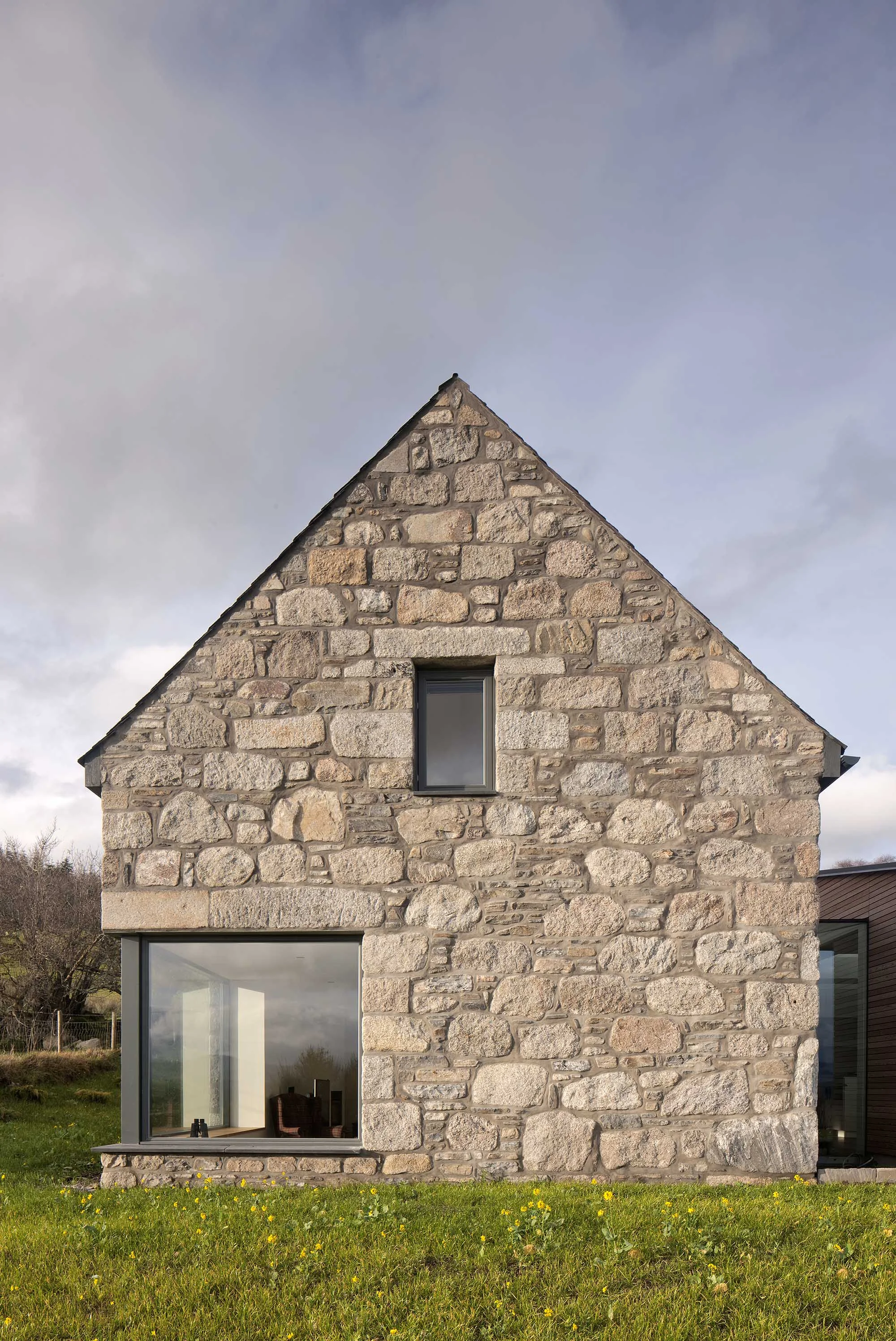 Gable end stone steading with corner window