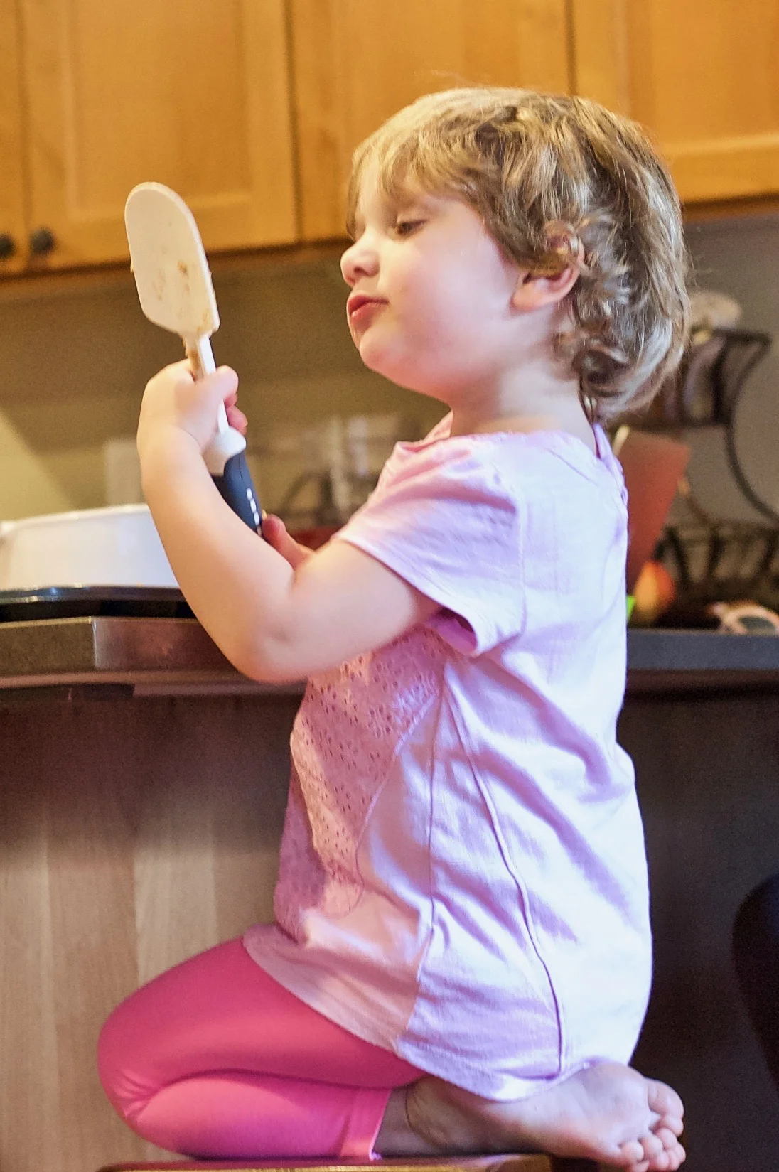G's shot of R baking in the kitchen
