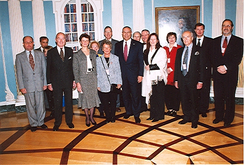 Reception for the families of the Visas for Life diplomats with Secretary of State Colin Powell at the State Department, Washington, DC, 2003. Eric Saul (right).