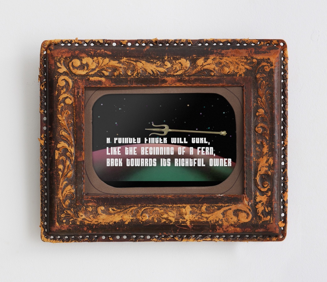 A pointed finger curls back to its rightful owner , 2012 Video, dedicated tablet, vintage leather frame, 10 x 6 inches