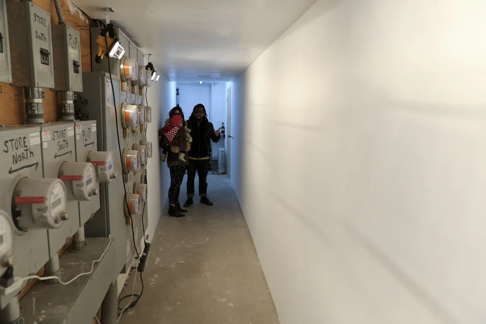 you let me love you, until i was a failure…,2013, Sheetrock, studs, plaster, paint, winch, chain (dimensions variable)