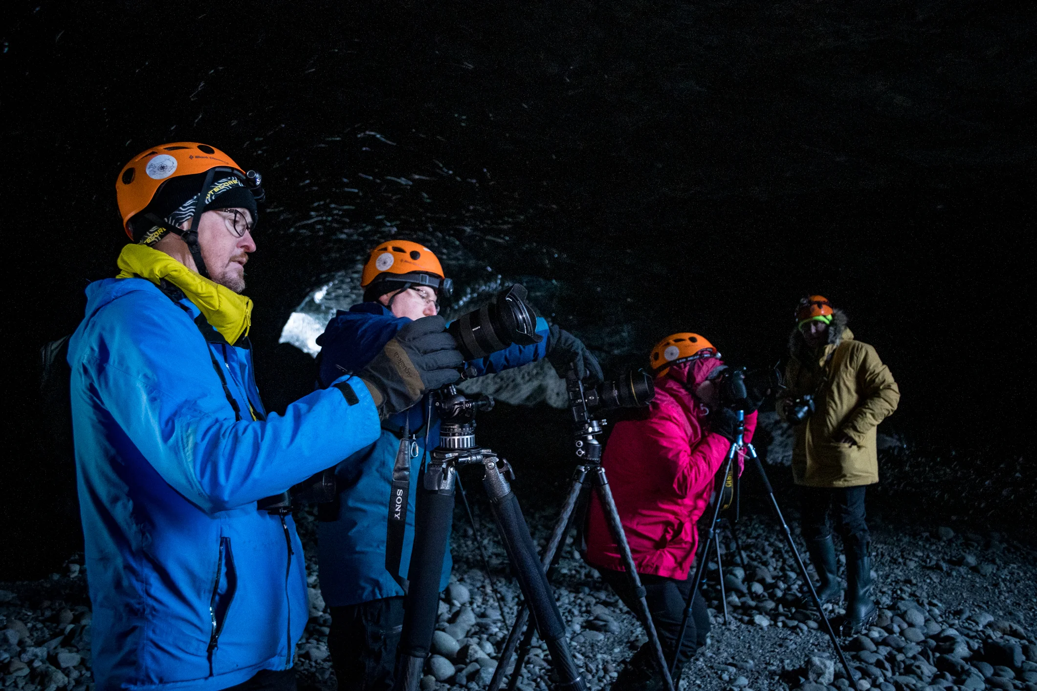 Páll Jökull shooting inside the cave together with the workshop participants.