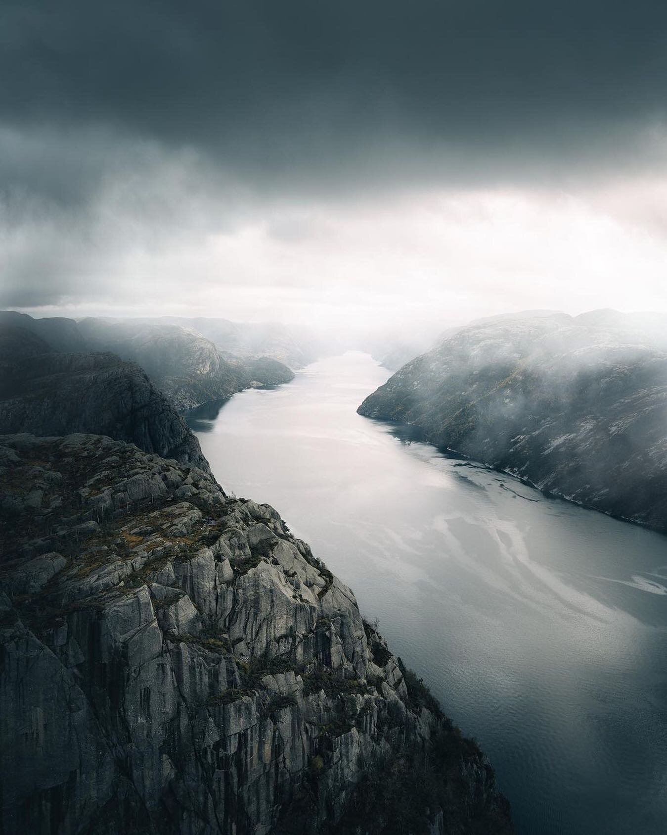 @joinolli With its lightly colored granite walls drenched in recondite black, Lysefjorden provided an initimidating display on this stormy day. Impressive and inviolable. Ever lasting ridges overlooking powerful efforts of long gone glaciers. Ice seg