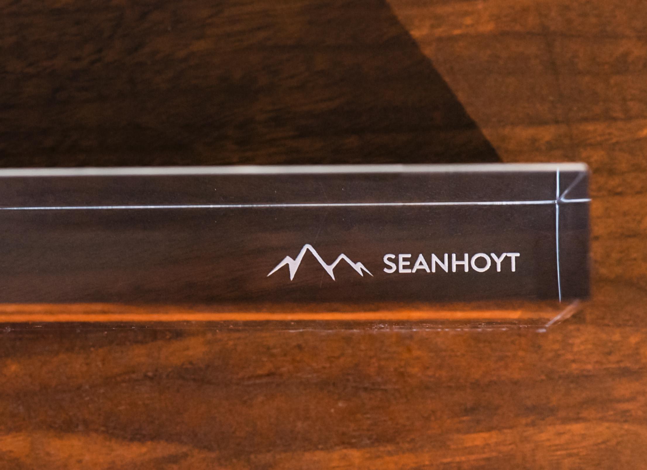 Logo is laser-engraved in reverse on the bottom to show up through the acrylic when the print is standing upright.