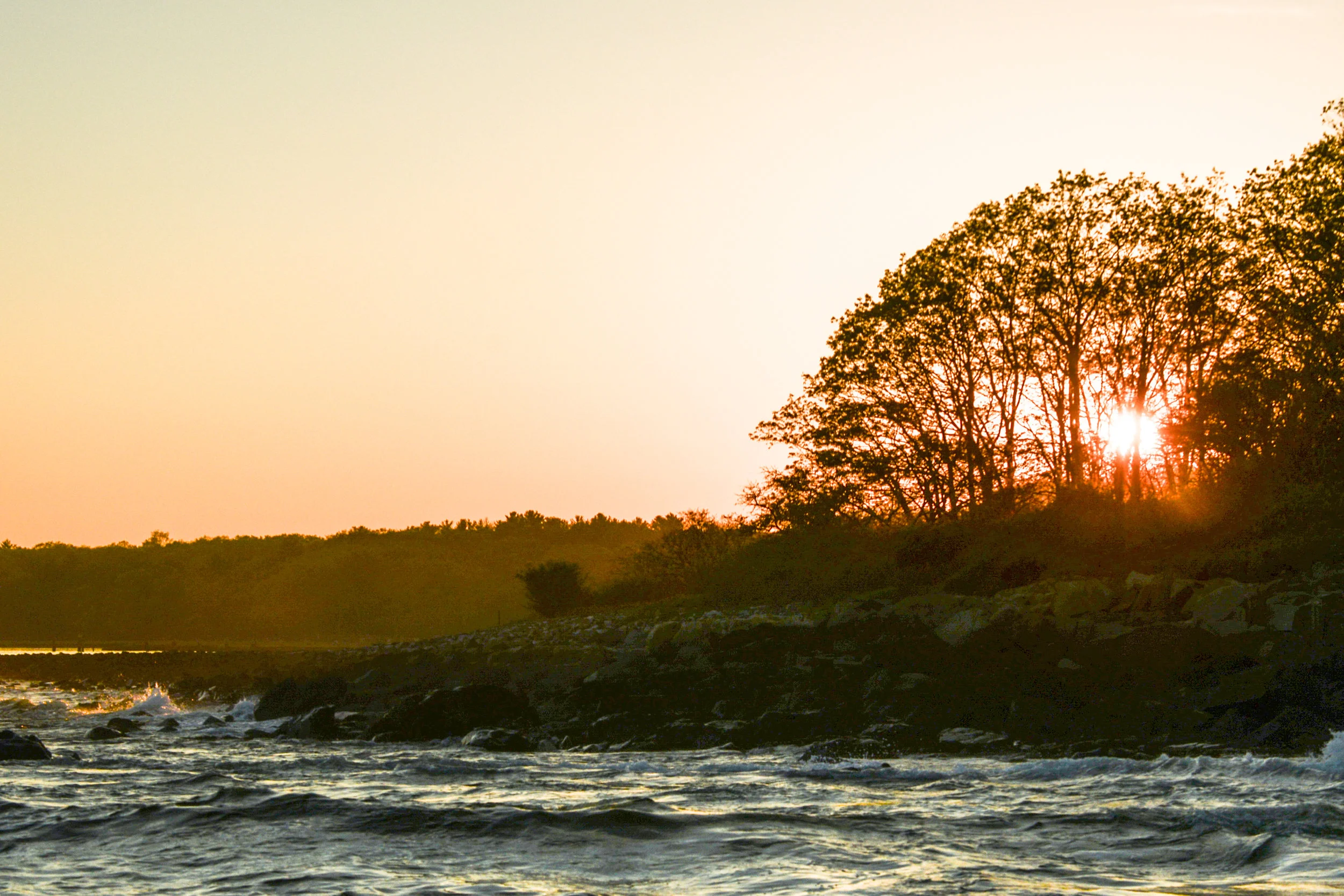 A calm evening on the ocean. Surf rolled through from weather offshore creating a perfect texture to the water. Rolling waves create currents and situations for bait to be stunned by impact with the rocky shoreline. Stripers use these situations to their advantage. 