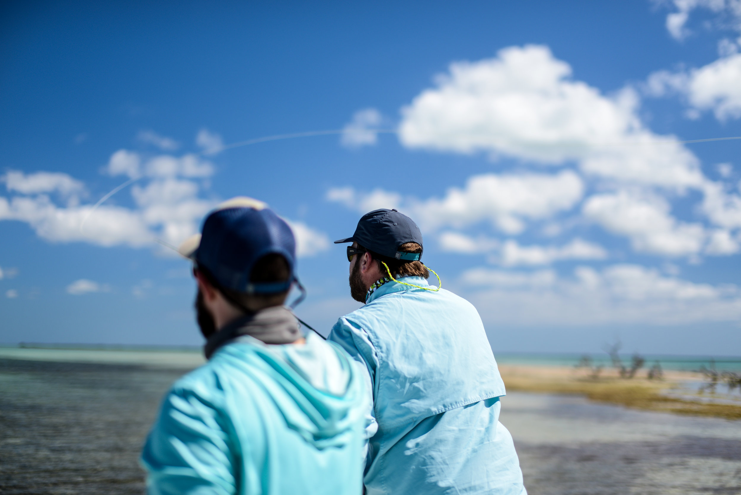 Good friends casting to tailing fish. 