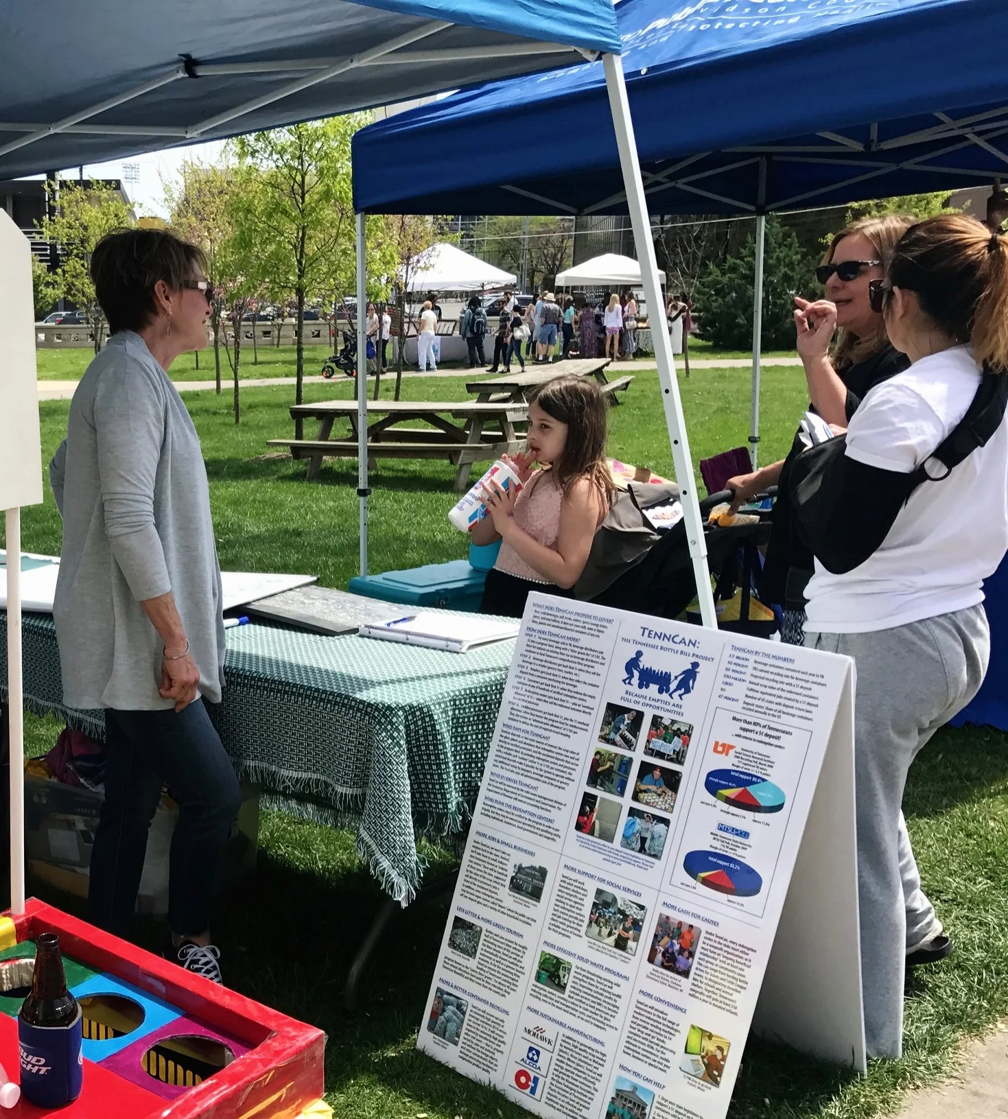 Susan Appelt explains TennCan to interested festival-goers.