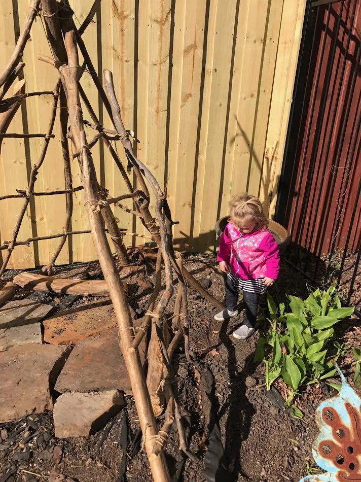 Helping me make the teepee