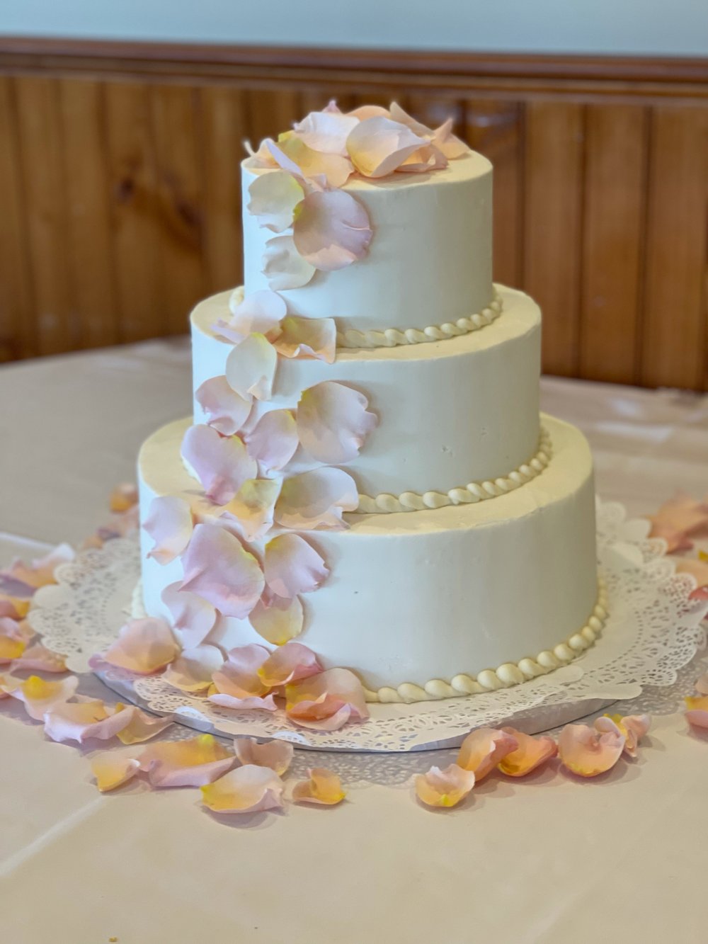 Wedding cake with rose petals