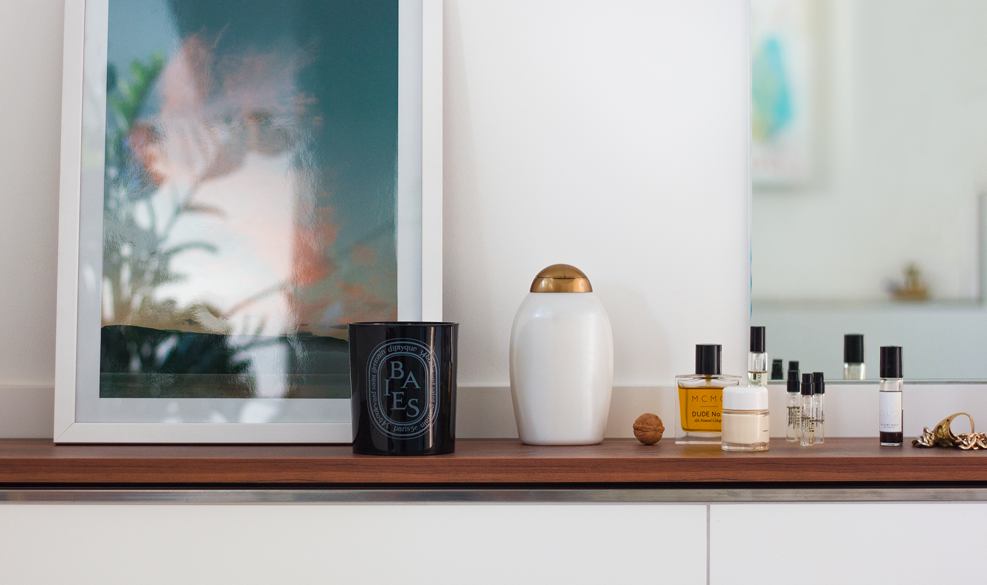 The Diptyque Baies candle sitting in the bathroom.