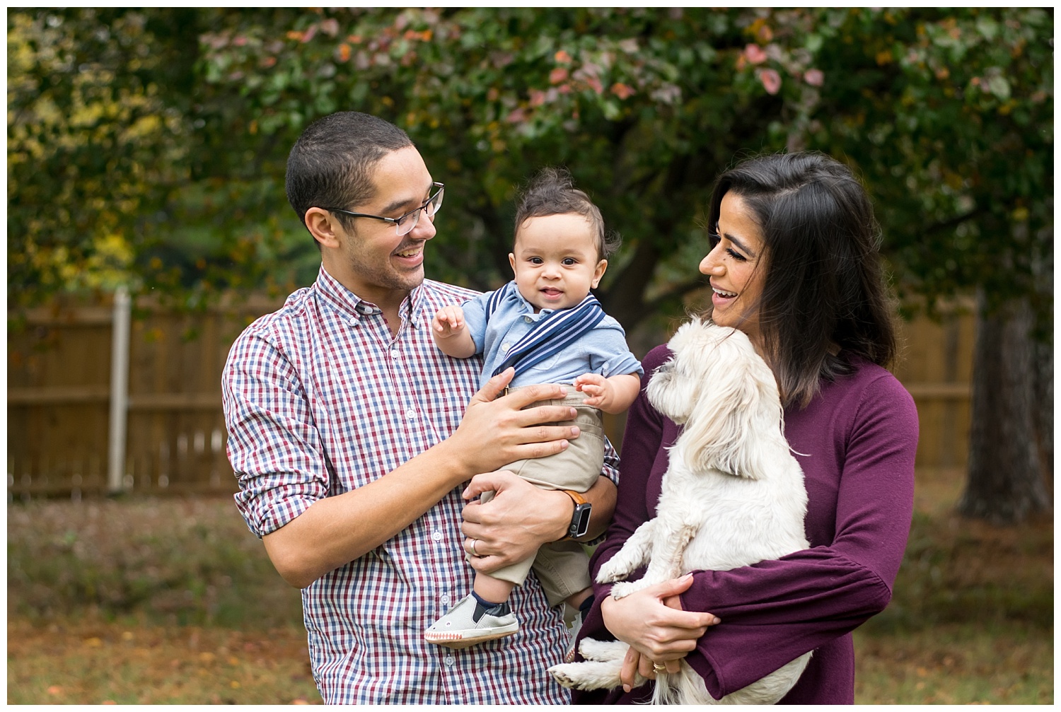 this is an image of a mother and father holding their six month baby boy during a lifestyle family session in marietta, georgia