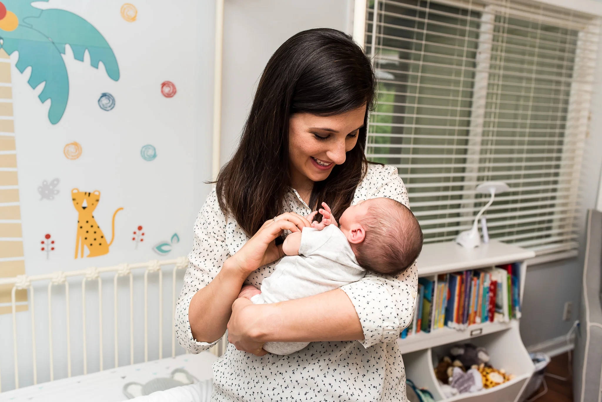 atlanta-newborn-photography-mom-holding-baby-nursery