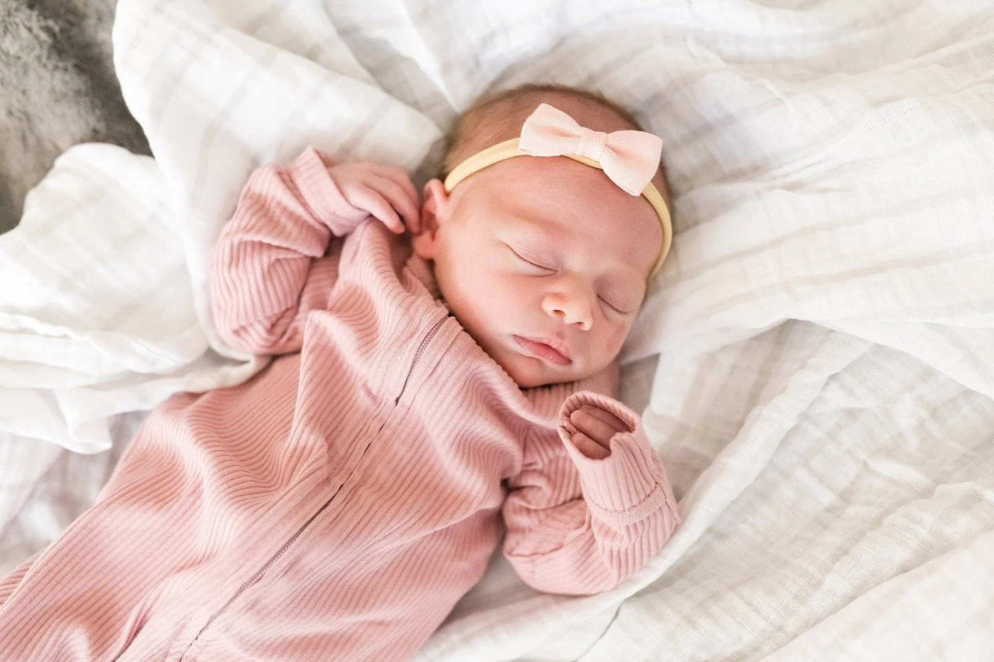 Your newborn is perfect just the way they are! We took this photo on a bean bag the family had in their living room. We also got some adorable photos with big sister. I love how they turned out! Contact me to schedule your in home newborn session!