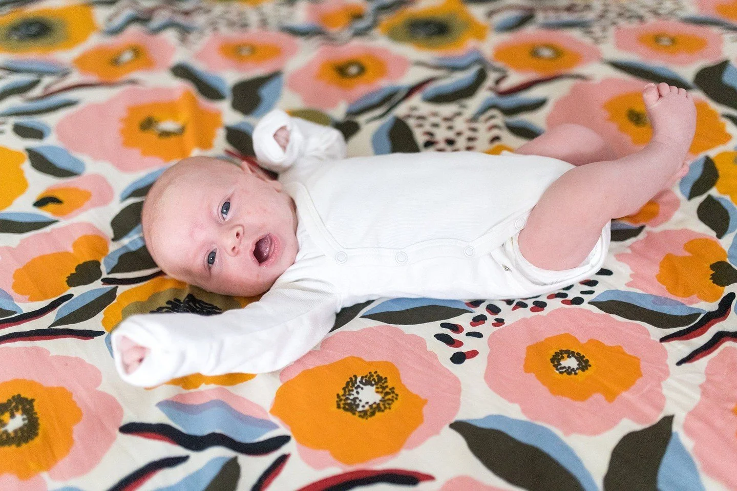 This little guy did such a good job during his newborn session! We got several images of him in simple onesie with this beautiful bedspread. We also got close up portraits and headshots of him, and even some simple diaper shots. And of course many im