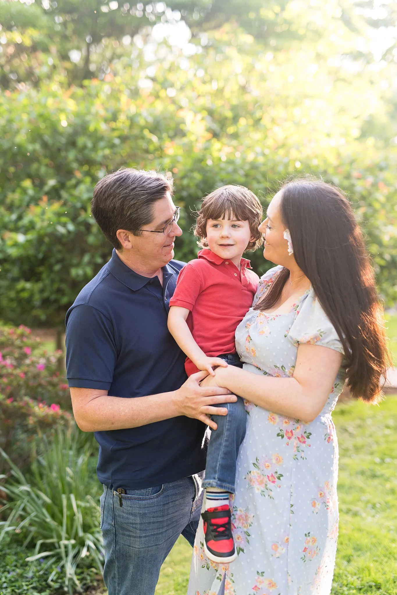 family of 3 in the springtime for mini session in kensington maryland with tabitha maegan photography